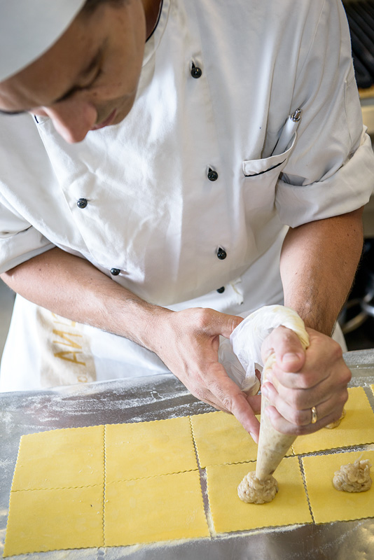 Chef preparing ravioli in the kitchen of Boccanegra Restaurant and Osteria in Florence