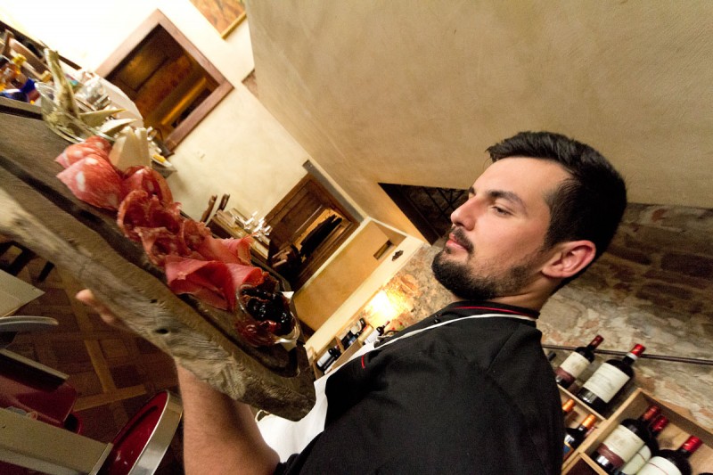 Our chef preparing the Tuscan specialties dish at Osteria Boccanegra Florence